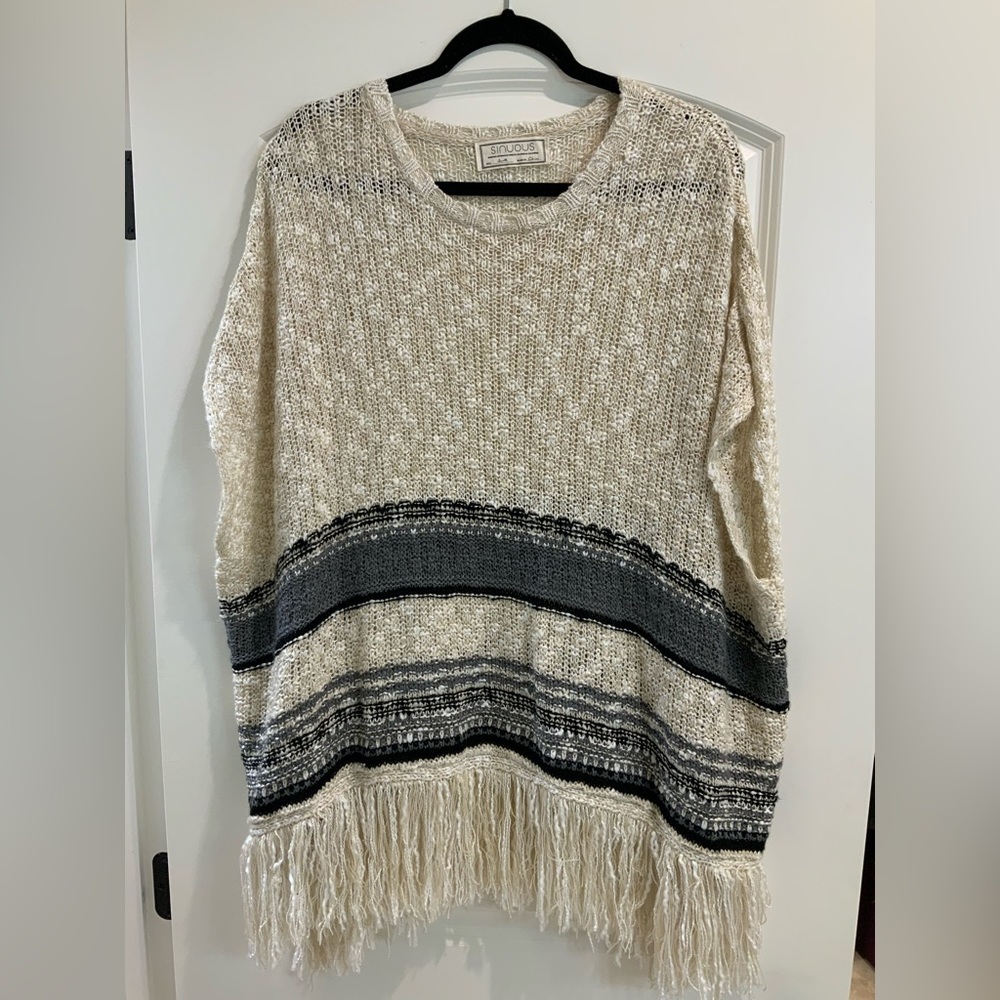 Sinuous Small Sweater Poncho with Fringe Detail